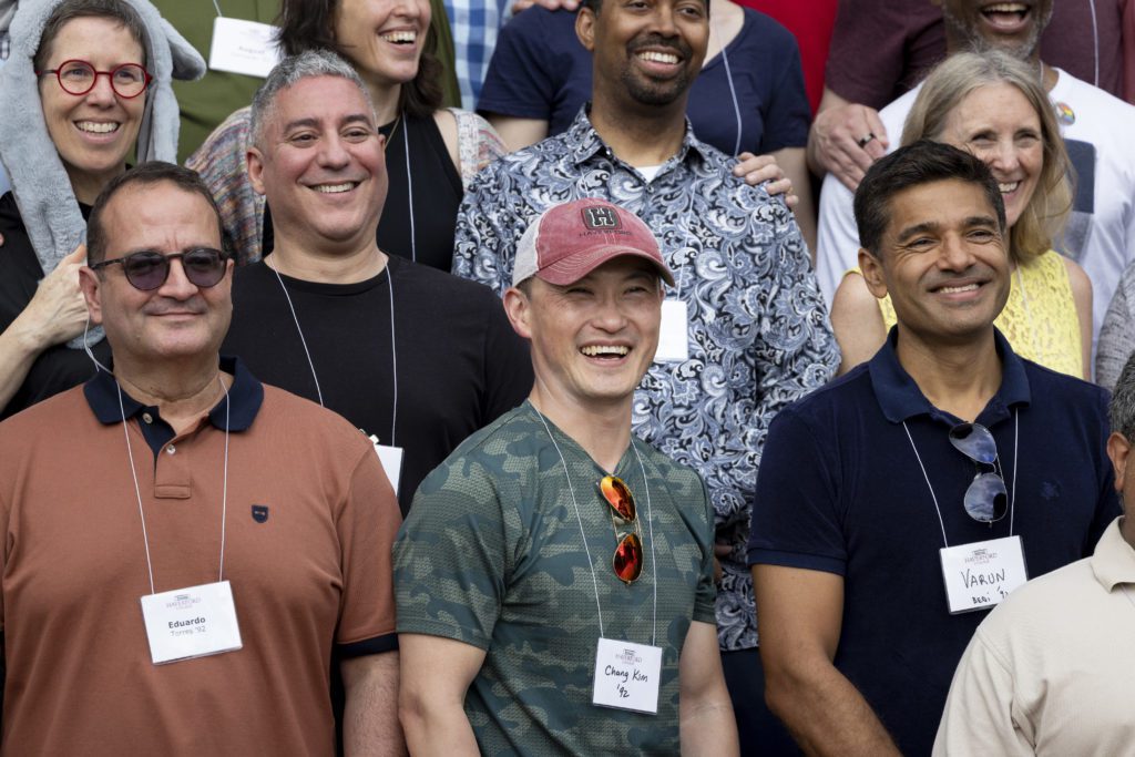 A close-up on about 7 members of the Class of 1992 during their class portrait.