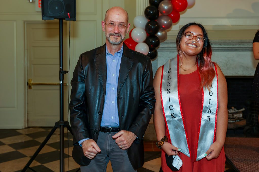 Jeff Tecosky-Feldman and Erica Kaunang smile at the podium