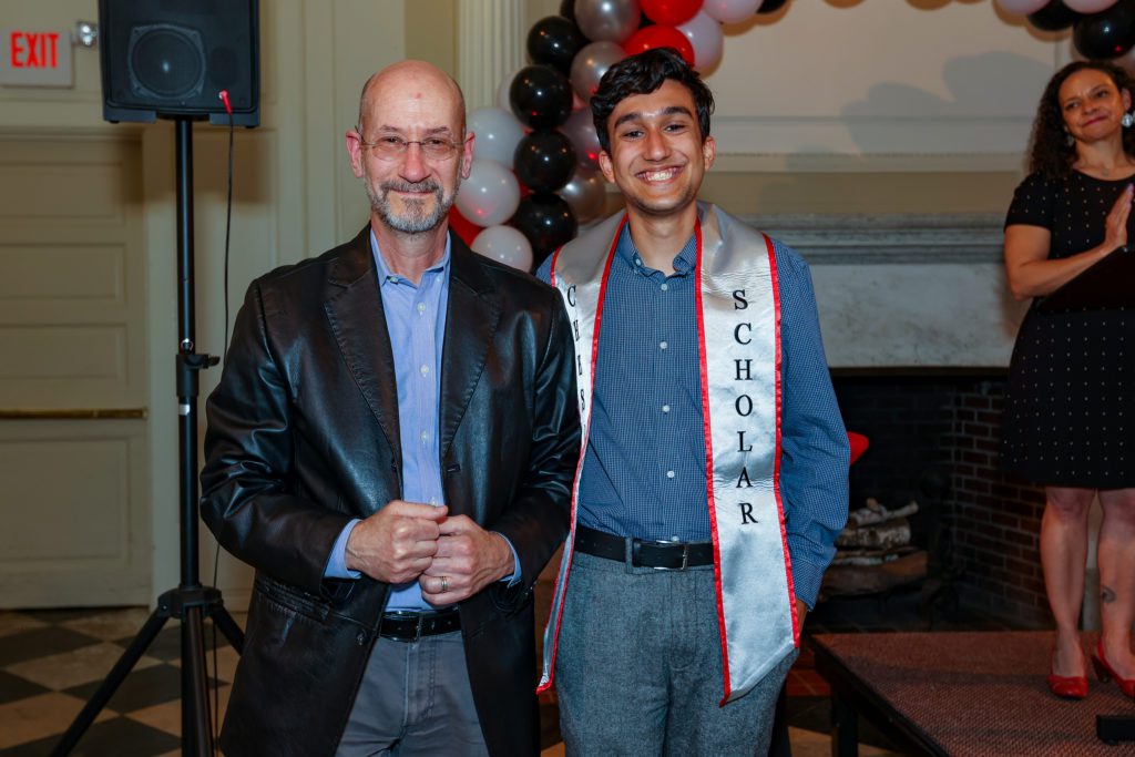 João Pedro Carvalho poses with Jeff Tecosky-Feldman after receiving his Chesick Scholar sash