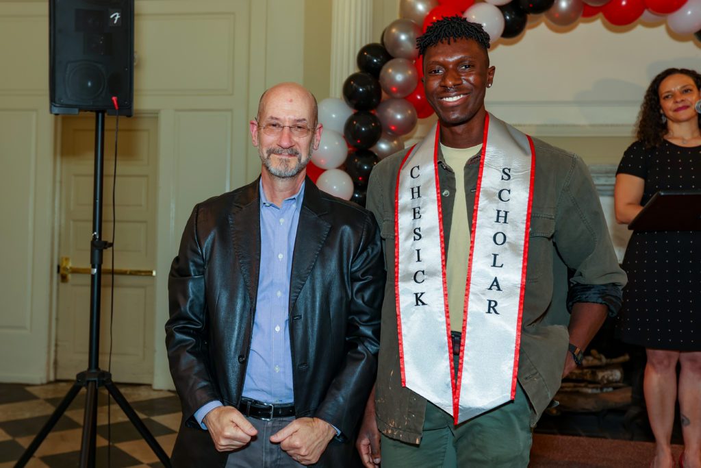 Jeff Tecosky-Feldman poses next to Olufemi Obiwumi
