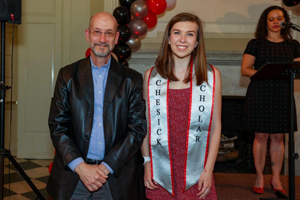 Angie Petrichenko poses next to Jeff Tecosky-Feldman after receiving her Chesick Scholar sash