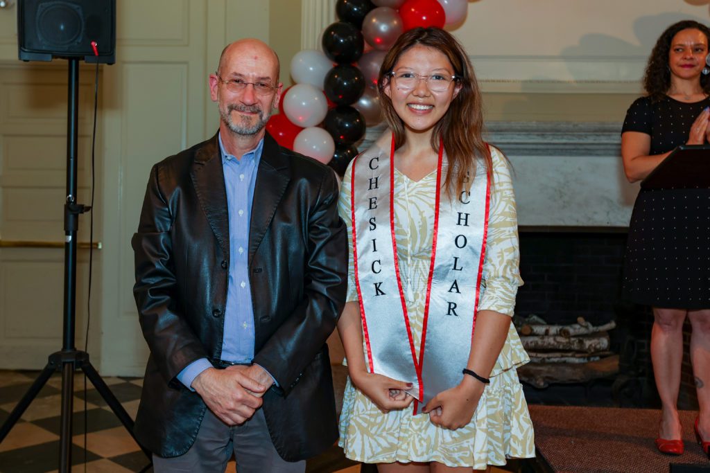 Urgyen Wangmo poses next to Jeff Tecosky-Feldman after receiving the Chesick Scholar sash