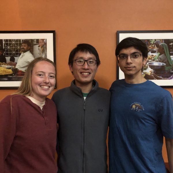 Trinity Kleckner '24, Sam Tan '23, and Wahub Ahmed '25 stand together.