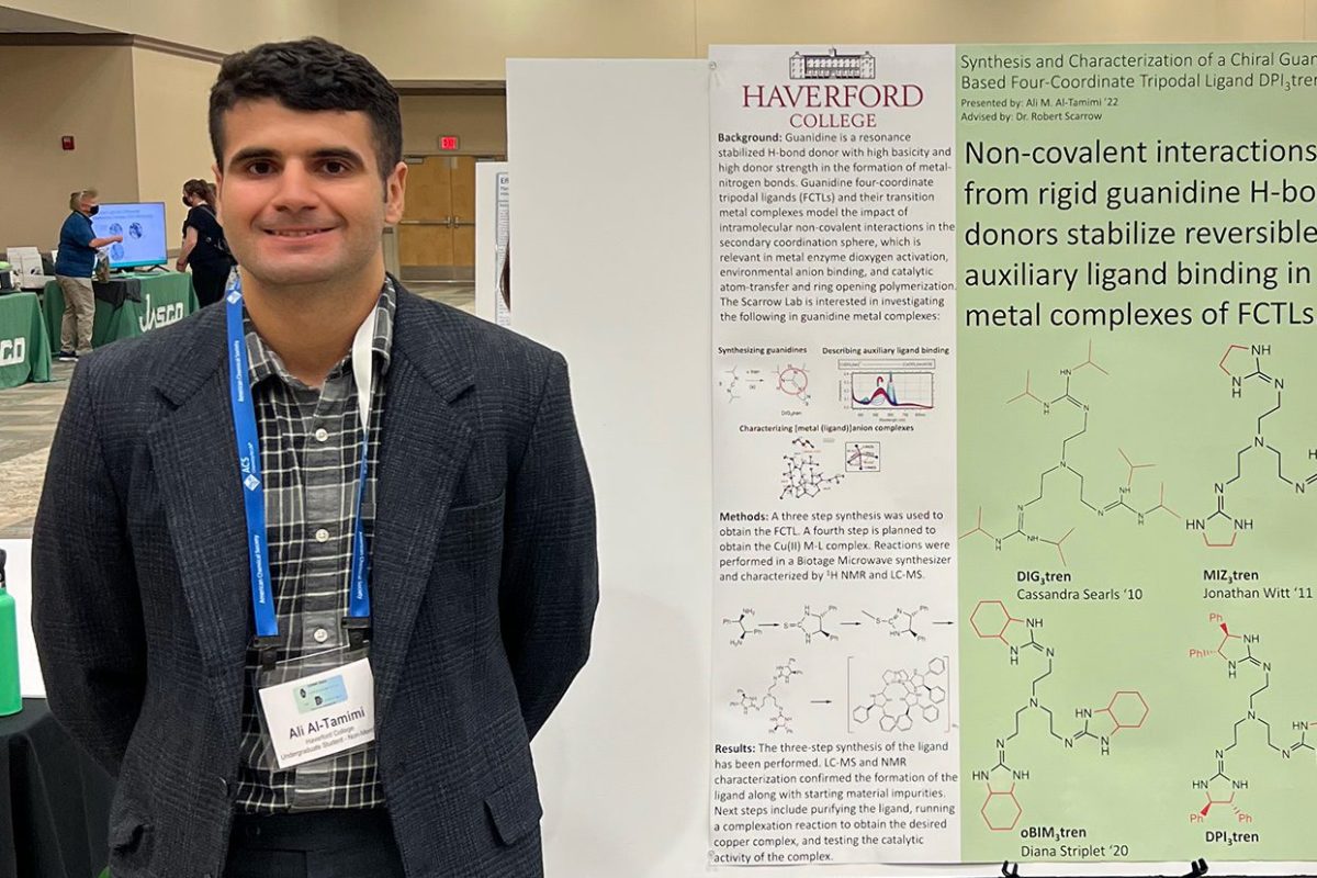 Ali Altamimi '22 stands in front of his poster at the Central Regional Meeting of the American Chemical Society.