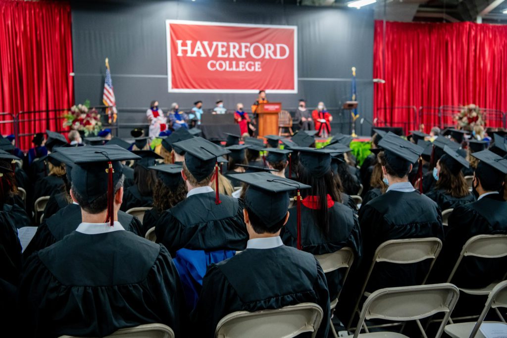 A view of Lindsay onstage from behind the sea of black caps and gowns.