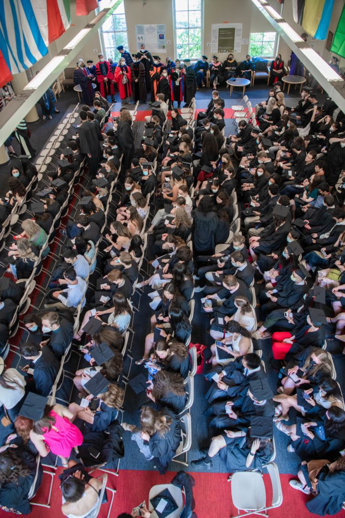 A view of the Class of 2020 in their seats in their caps and gowns taken from above