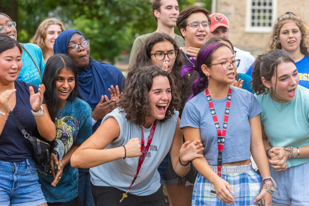 Members of the blue team laugh and look surprised.