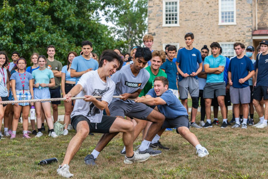 The tug of war with the blue team watching.
