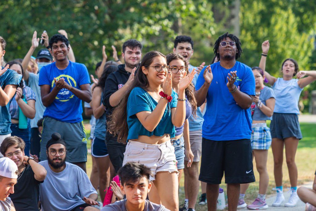 The blue team cheers and claps.