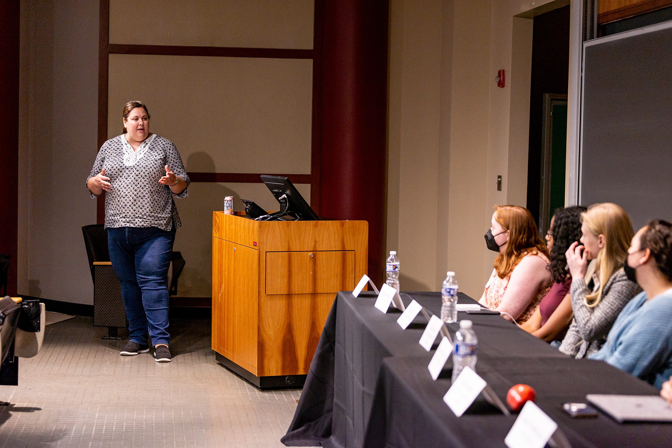 Professor Kristen Whalen talks to the panel of student researchers. Photo by Patrick Montero.