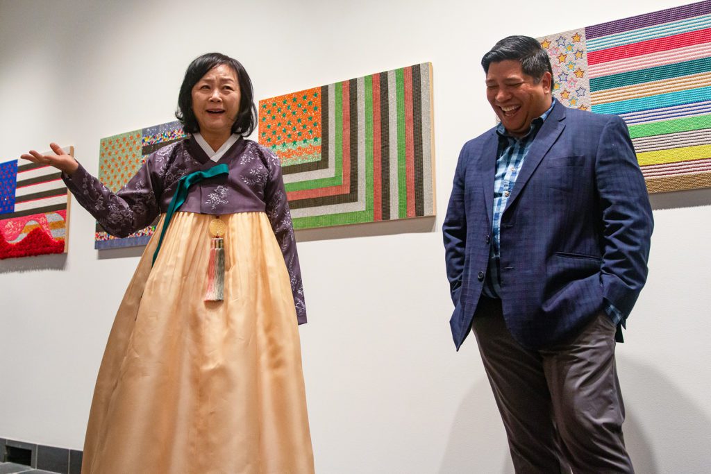 Professor Kim and Dr. Ricardo Reyes sharing a laugh at the exhibition opening. Photo by Alexandra Iglesia '21.