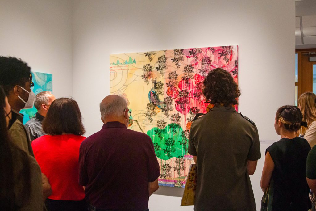 Exhibition attendees examining Professor Kim's work. Photo by Alexandra Iglesia '21.