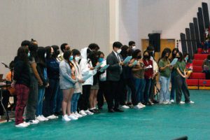 Students stand in front of the community at the GIAC and discuss campus issues. Photo by Abigail Trapp '26.