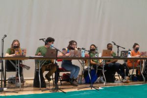 Plenary's moderators speak into a microphone. Photo by Logan de Raspide Ross '23.