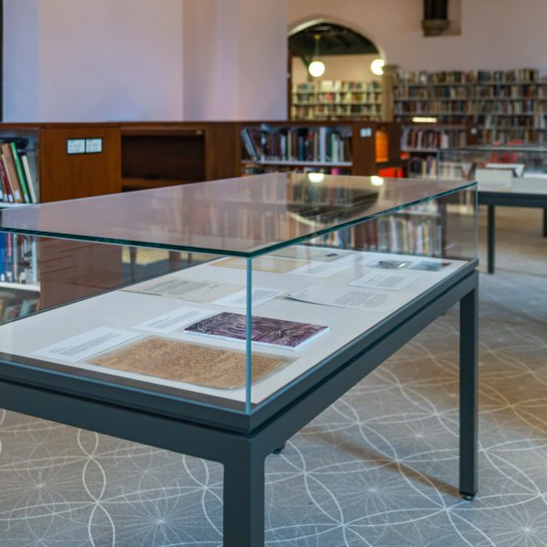 A display case with exhibit materials sits in the Magill Wing of Lutnick Library.
