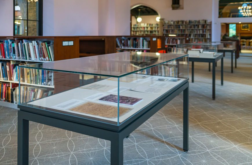 A display case with exhibit materials sits in the Magill Wing of Lutnick Library.