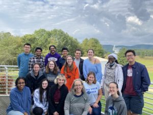 16 students and Professor Masters pose outside at the Green Bank Observatory