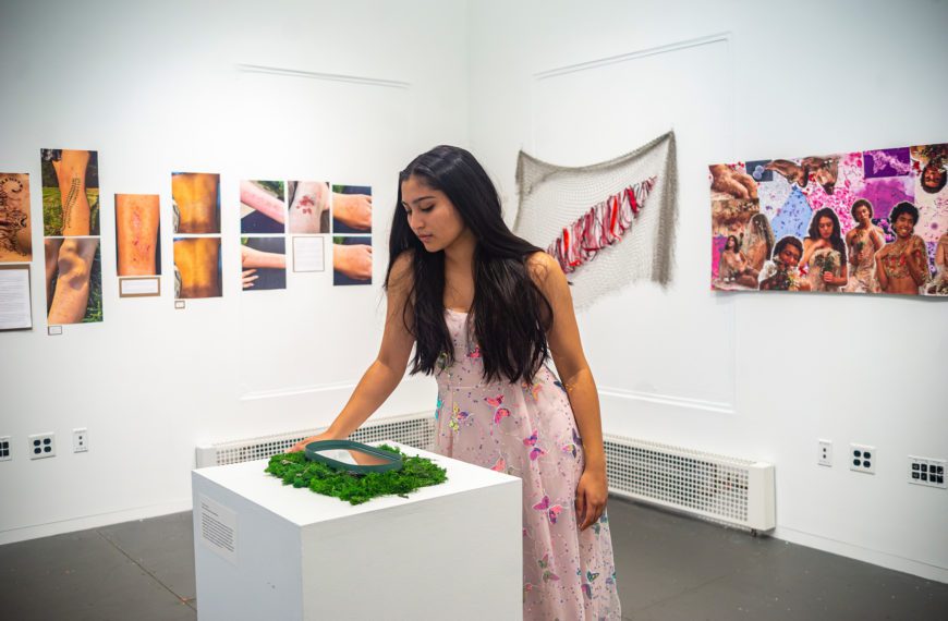 Izzy Ray '23 looking at her reflection in her "Pool of Narcissus."