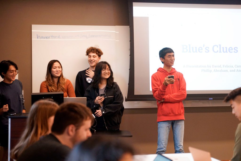 The team "Blue's Clues" presents their project to the Hackathon's attendees. Photo by Anna Braun '26.
