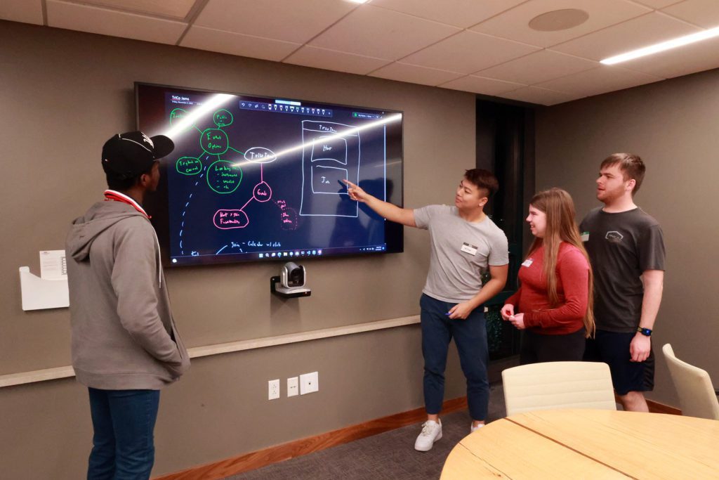 Students present a project at the Tri-Co Hackathon. Photo by Ella Mbanefo '26.
