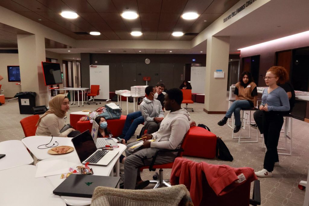 Students discuss a project in Lutnick Library. Photo by Ella Mbanefo '26