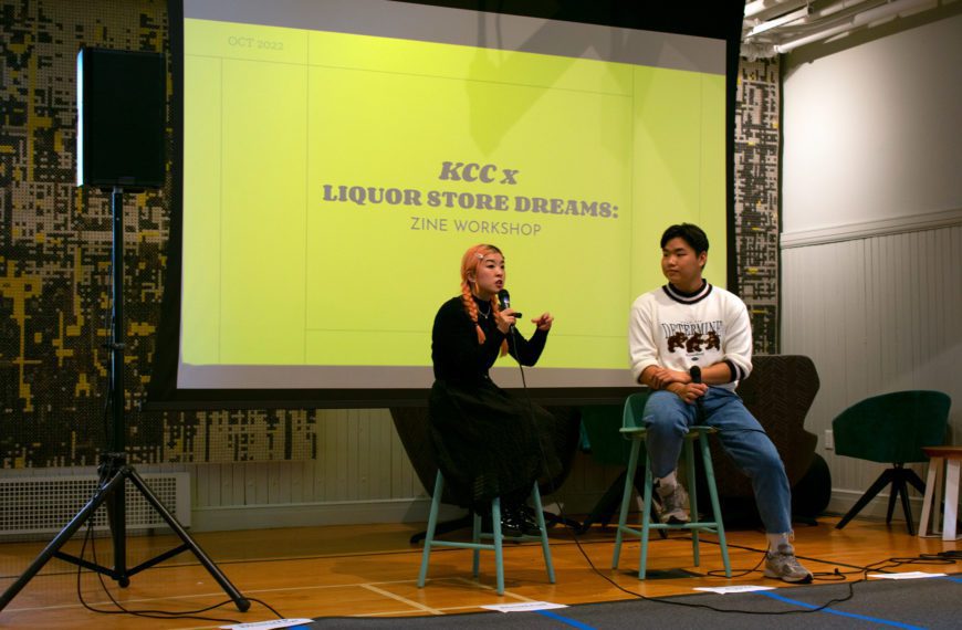 Director So Yun Um (left) sitting with Yehyon Song '25 in front of a projector at the "So, Let's Talk About It" event as part of the Strange Truth series.