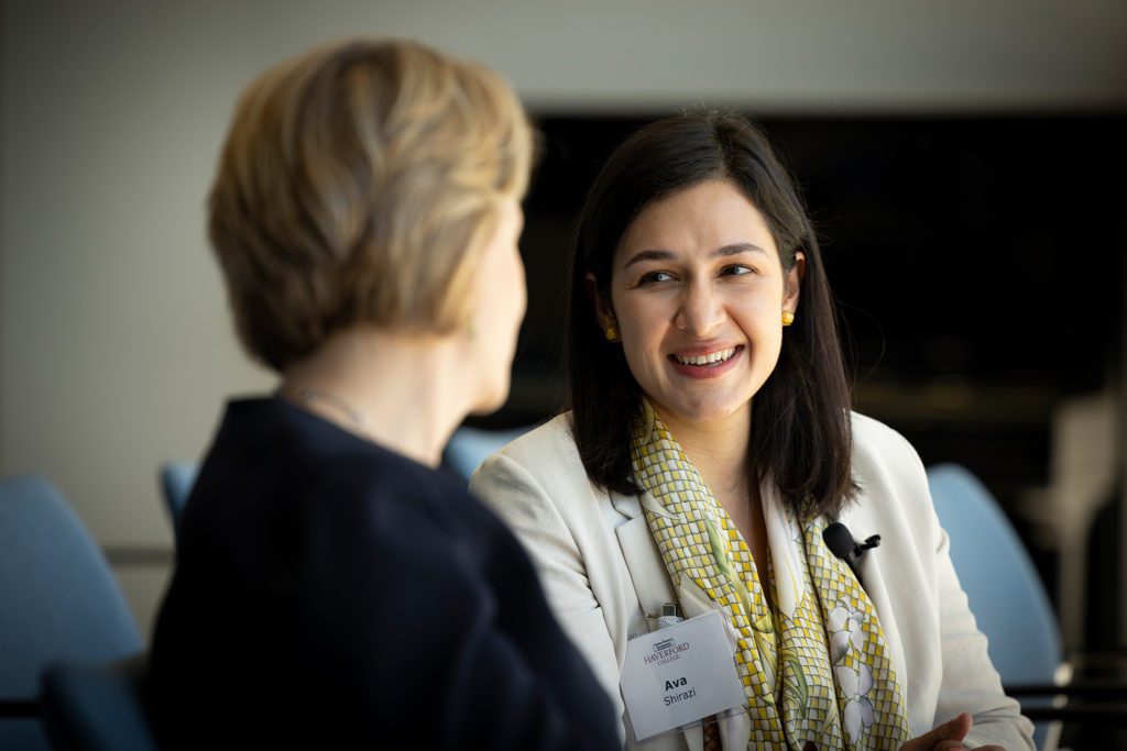 Ava Shirazi smiles at President Raymond during their conversation.