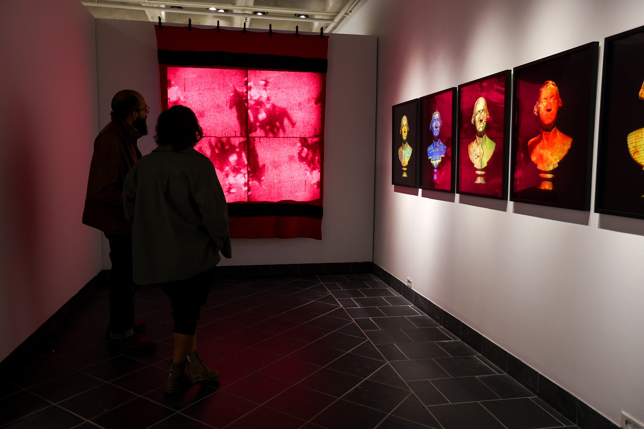Patrons view "Native America: In Translation" at the exhibit's opening event. Photo by Paola Nogueras.