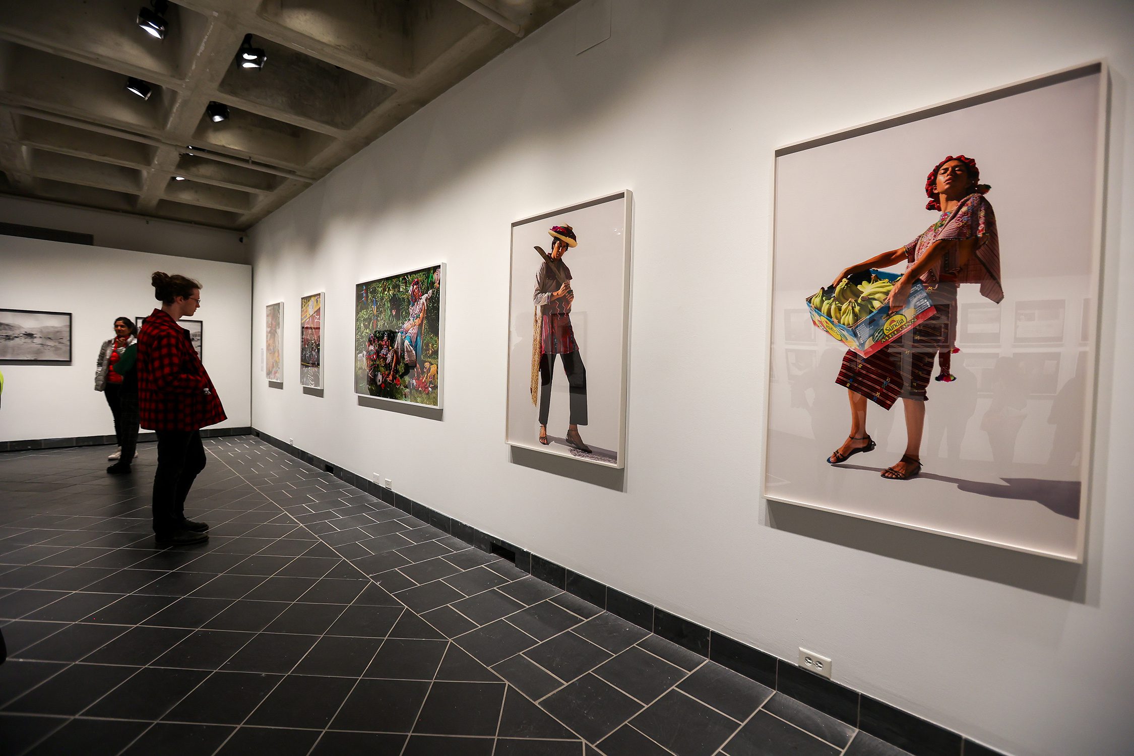 Patrons view "Native America: In Translation" at the exhibit's opening event. Photo by Paola Nogueras.