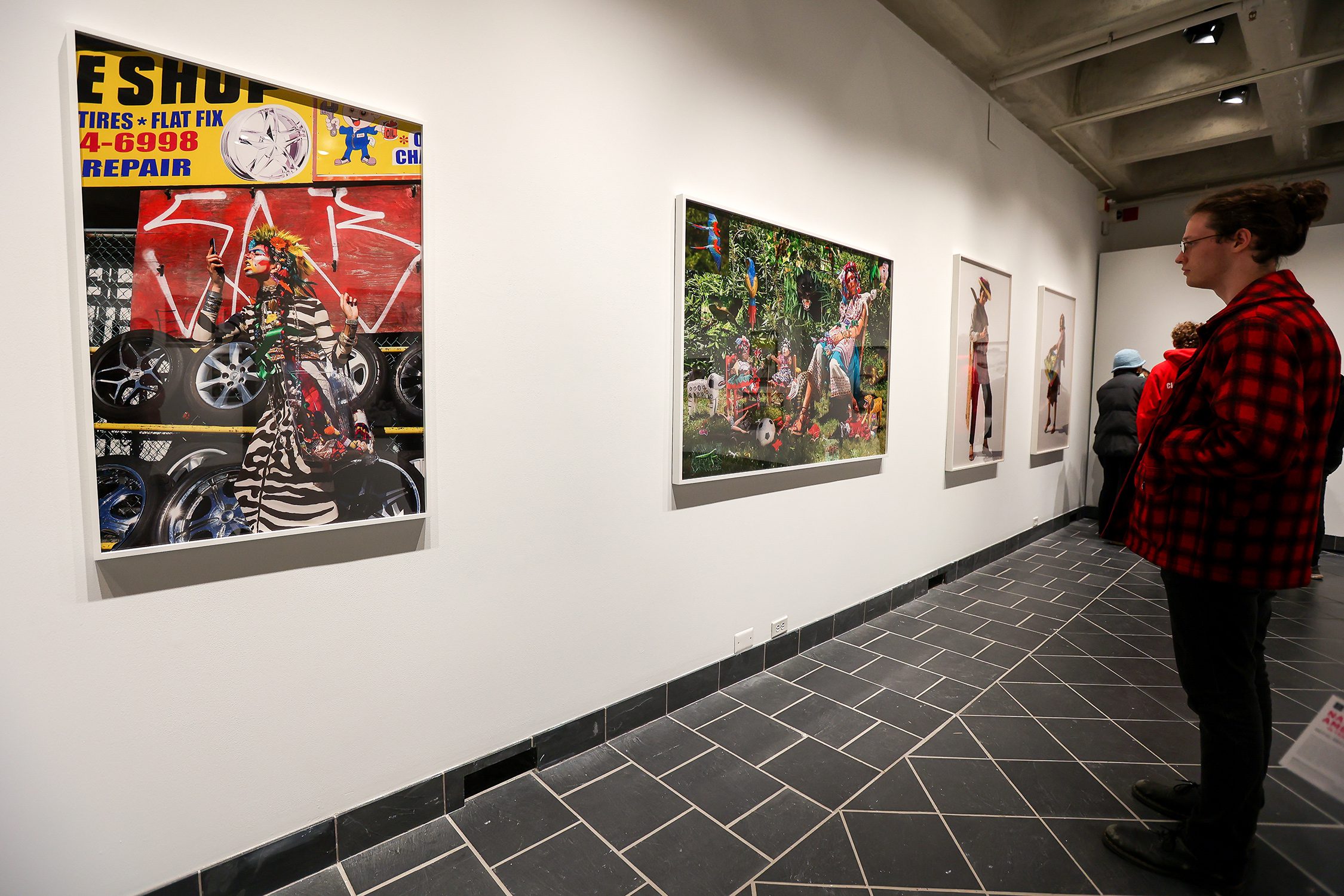 Patrons view "Native America: In Translation" at the exhibit's opening event. Photo by Paola Nogueras.