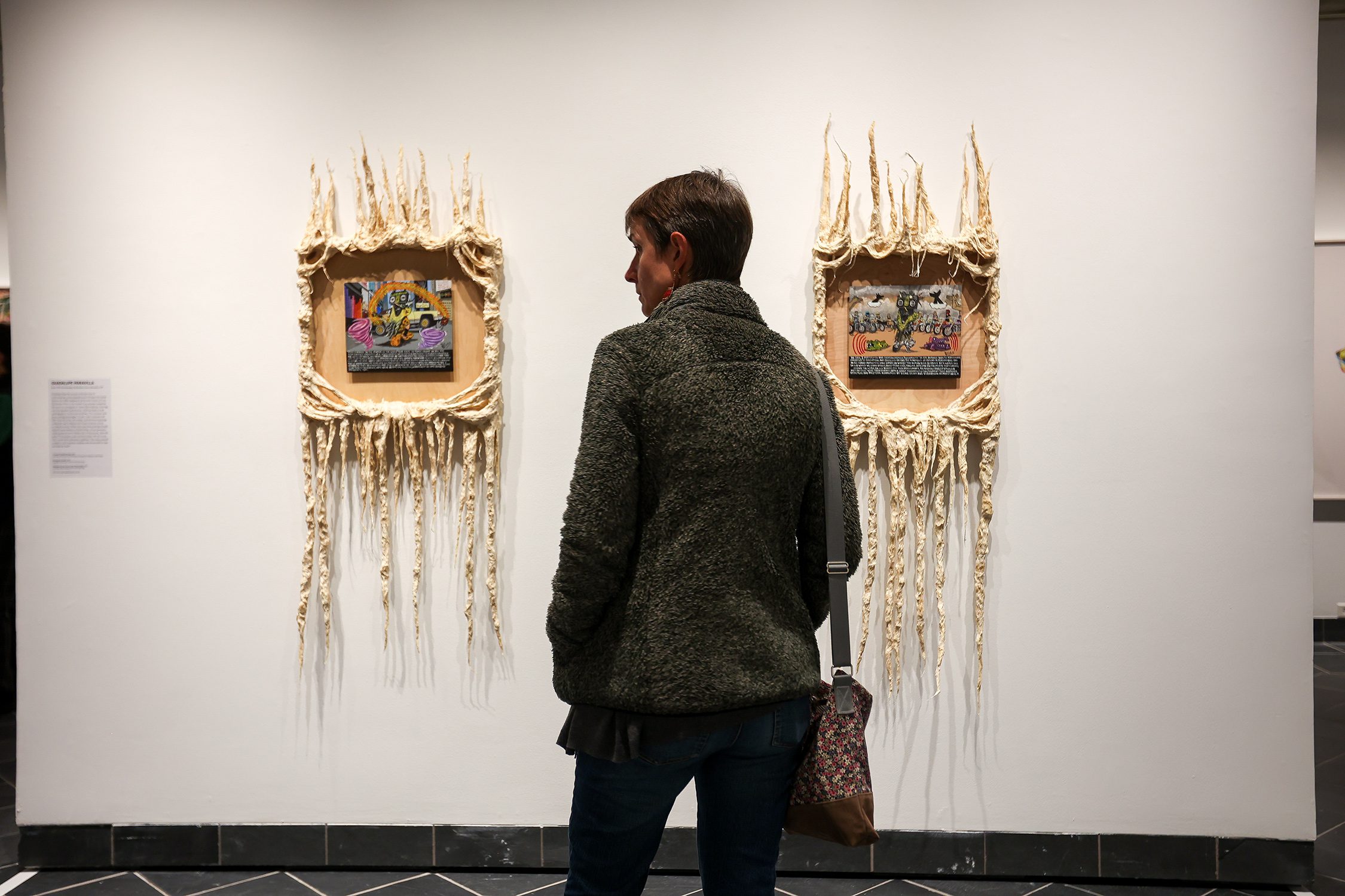 Patrons view "Native America: In Translation" at the exhibit's opening event. Photo by Paola Nogueras.