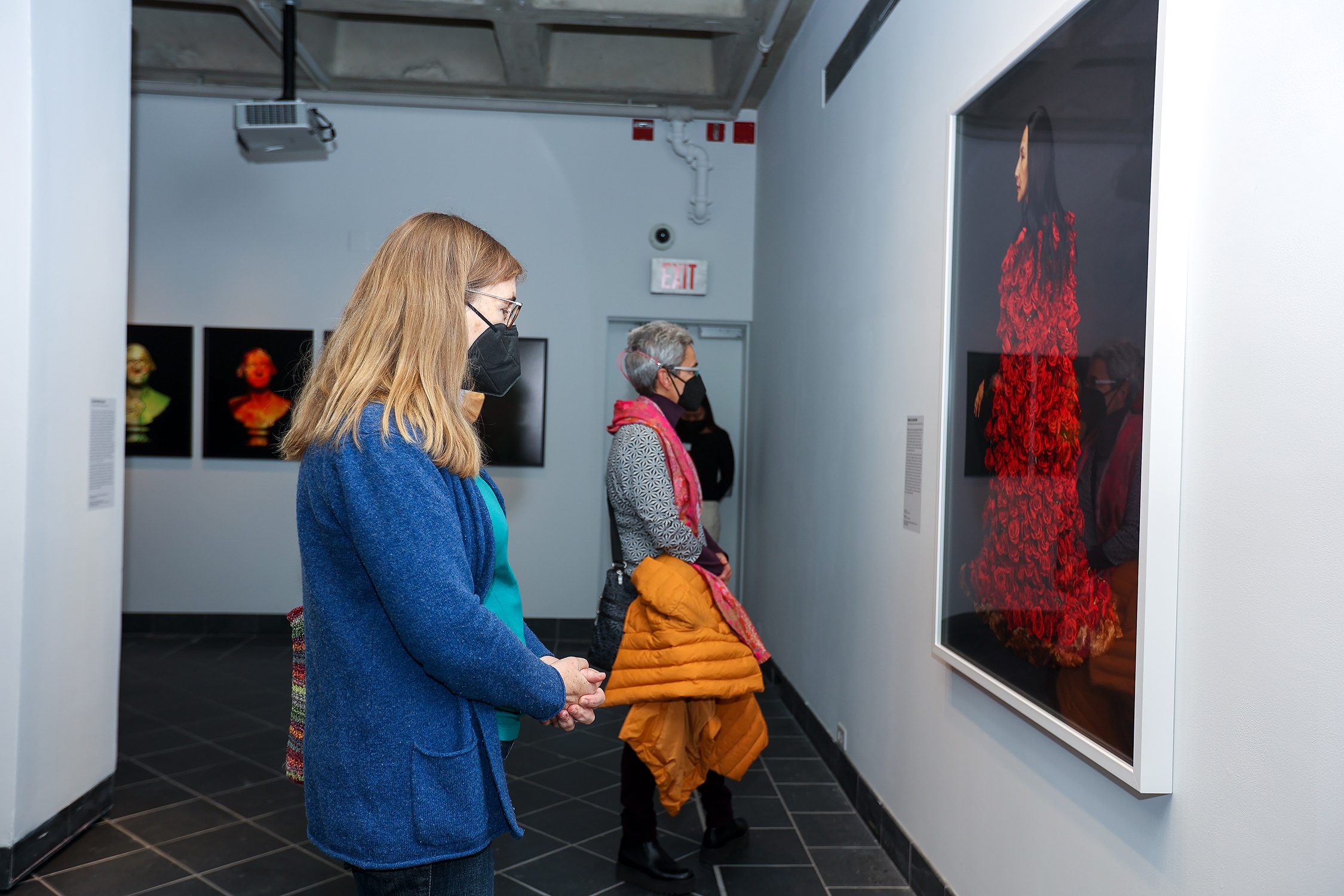 Patrons view "Native America: In Translation" at the exhibit's opening event. Photo by Paola Nogueras.
