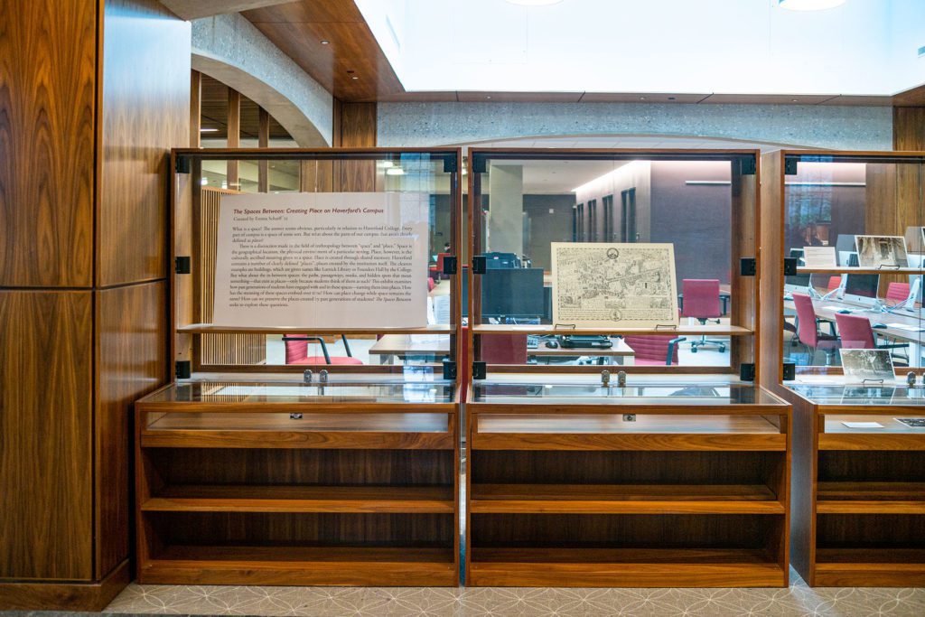 Picture of the display cases containing "The Spaces Between." Photo by Patrick Montero.