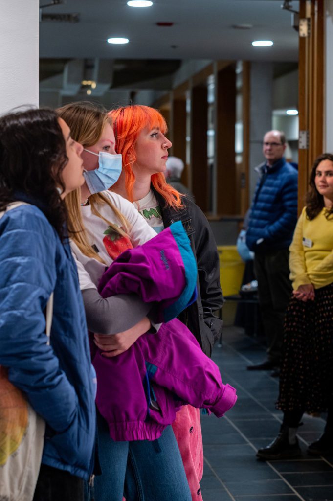 Attendees at the exhibition opening. Photo by Logan de Raspide Ross '23.