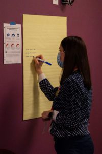 An attendee participates in an activity during "Undocumented in US Higher Education." Photo by Anna Braun '26.