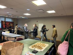 Participants engage with each other at the closing and networking session following the conference. Photo by Abigail Trapp '26.