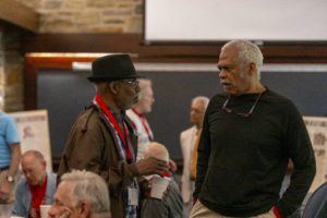 two alumni in conversation at Class of 1973 Breakfast