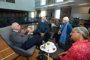 group of alumni sitting and chatting in the VCAM