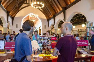 Students talking at academics fair_photo by Patrick Montero