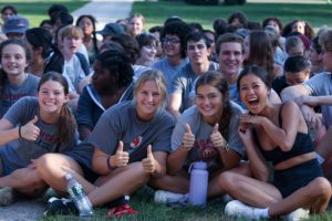 Students and gray shirts giving the thumbs up to the camera_photo by Paola Nogueras
