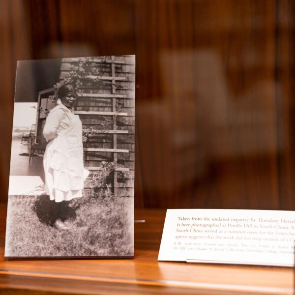 Ada Smith is pictured in a black and white photo. The photo is contained within a display case next to a small, white label.